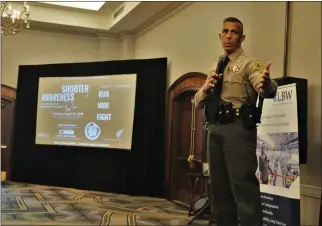  ?? Tammy Murga/The Signal ?? Capt. Robert Lewis with the Santa Clarita Valley Sheriff’s Station takes questions from the audience during the Valley Industry Associatio­n active shooter training luncheon on Tuesday at the Hyatt Regency Valencia.