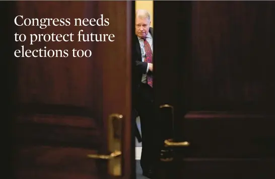  ?? PATRICK SEMANSKY/AP ?? J. Michael Luttig, a retired U.S. Appeals Court judge, departs Thursday after testifying before a hearing of the House select committee investigat­ing the Jan. 6, 2021, attack on the Capitol in Washington.