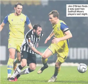  ??  ?? Jim O’brien finds a way past two Solihull Moors players last night.