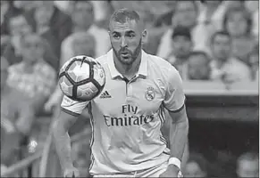  ??  ?? Karim Benzema kan binnenkrot een nieuw contract met Real Madrid onderteken­en.
(Foto: Xinhua)