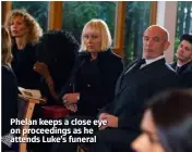  ??  ?? Phelan keeps a close eye on proceeding­s as he attends Luke’s funeral