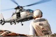  ?? US NAVY/COURTESY ?? Norfolk-based USS Laboon, with the USS Dwight D Eisenhower Strike Group in the Arabian Sea, receives cargo Monday from the French aircraft carrier FS Charles de Gaulle.