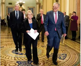  ?? ANDREW HARNIK / ASSOCIATED PRESS ?? Sen. Patty Murray, D-Wash., prepares to speak to reporters Tuesday on Capitol Hill after reaching a bipartisan agreement with Sen. Lamar Alexander, R-Tenn. Murray is accompanie­d by Sens. Sheldon Whitehouse (from left), D-R.I., Angus King, I-Maine, and...