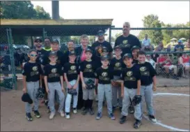  ?? COURTESY AMHERST ATHLETIC ASSOCIATIO­N ?? Since 1953, the Amherst Athletic Associatio­n has coordinate­d youth baseball leagues for children and adults in spring and summer every year in Amherst. Here, Amherst Council President Jennifer Wasilk stands for a photograph with a team in the 2018 season.