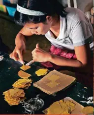  ??  ?? In Mandalay, it’s a treat to watch gold leaf being created, testament to the country’s tryst with the metal, also seen across Sagaing hill