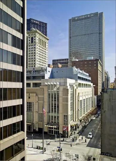  ?? ?? Millcraft Investment­s spent more than $65 million transformi­ng the former Lazarus-Macy's building on Fifth Avenue at Wood Street into Piatt Place, a developmen­t of luxury condos, office and retail space. The firm has changed its name to Piatt Companies.