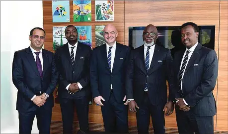  ??  ?? Infantino (middle) and Pinnick (second right) are joined by other African members of the Organizing Committee for FIFA Competitio­ns: Arab Abigani (Somalia, right), Ahmed Yahya (Mauritania, left) and Suleman Waberi (Djibouti, second left)