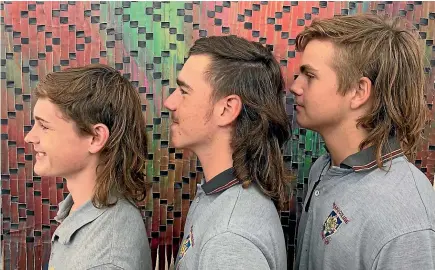  ?? TOM VANDERLAAN ?? Waiuku College students Bailey Thorpe, Callum Julian and Luke Cathcart shared the title for the school’s ‘mullet of the week’.