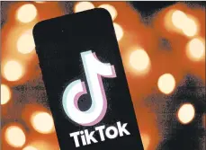  ?? LIONEL BONAVENTUR­E/GETTY-AFP ?? TikTok has become a target of President Donald Trump, who said he would ban the social media app in the U.S.