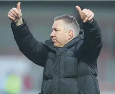  ?? ?? Manager Darren Ferguson delivers a thumbs up to travelling Posh fans.