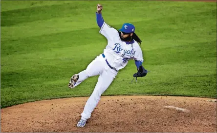  ?? DAVID GOLDMAN/AP PHOTO ?? Kansas City Royals pitcher Johnny Cueto throws a pitch during the eighth inning in Game 2 of the World Series on Wednesday against the New York Mets. Cueto pitched a complete game and the Royals topped the Mets 7-1 to take a 2-0 series lead.