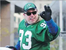  ?? NICK PROCAYLO ?? Corner Gas star Brent Butt waves to the crowd during the 102nd Grey Cup parade in Vancouver.