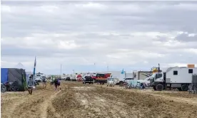  ?? Photograph: Brian Jensen Handout/EPA ?? Heavy rain stranded about 70,000 ‘burners’ at the festival this weekend.