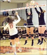  ?? MIKE ECKELS EAGLE-OBSERVER ?? Prairie Grove sophomore Savannah Smith (left) and senior outside hitter Hayden Vertz attempt to block a hit by Gravette during a volleyball match at Gravette on Thursday. Gravette took the win, 25-8, 25-16, 25-14, to hand the Lady Tigers (3-1) their first loss of the season. Prairie Grove plays host to rival Farmington on Thursday.