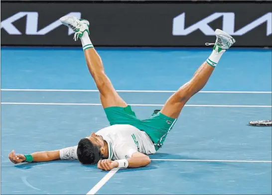  ?? Mark Dadswell The Associated Press ?? An emotional Novak Djokovic wins the Australian Open, his 18th major. His goal is 20 Grand Slam titles, a record shared by Roger Federer and Rafael Nadal.