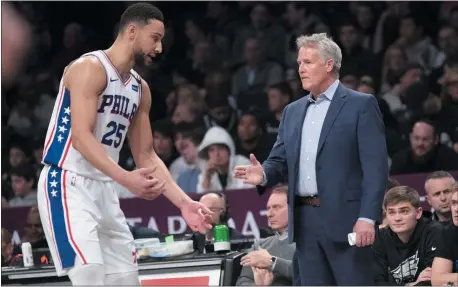  ?? MARY ALTAFER - THE ASSOCIATED PRESS ?? Philadelph­ia 76ers guard Ben Simmons, left, talks to head coach Brett Brown during the first half of Monday’s win over the Brooklyn Nets. Brown has learned to live with Simmons’ the way he is.