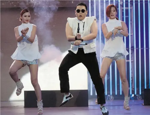  ?? Aaron Vincent Elkaim/ THE CANADIAN PRESS ?? South Korean rapper Psy hosted and performed during at the 2013 MuchMusic Video Awards in Toronto on Sunday.