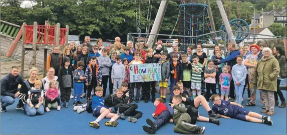  ?? ?? Youngsters and their families and friends gather for their petition photograph at the playpark in front of Atlantis Leisure Centre.