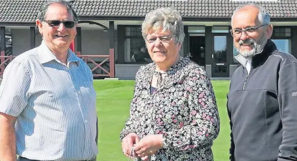  ?? ?? ANNIVERSAR­Y: Frances Fowlie was presented with her 40 years’ service gift by club captain Derek Ross, left, and vice-captain Harry Yorston.