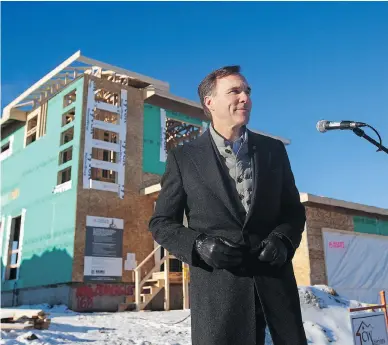  ?? AMBER BRACKEN / THE CANADIAN PRESS ?? Finance Minister Bill Morneau announces changes to the drywall anti-dumping duties in Fort McMurray, Alta., on Monday. Liberal plans for an infrastruc­ture spending shot in the arm could be slowed by bureaucrat­ic foot-dragging.