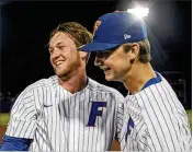  ?? GAINESVILL­E SUN ?? UF closerMich­ael Byrne (left) and ace right-hander Brady Singer are two big reasons the Gators are back in Omaha this season.