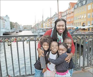  ?? Karen Akpan ?? KAREN AKPAN, here with her four children on vacation in Copenhagen, said she liked that Valiant Prep did not use a set curriculum. The school also let her use state education funds to take the family to Disneyland.