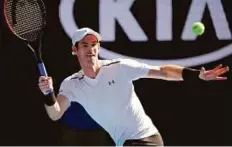  ?? AP ?? Britain’s Andy Murray plays a forehand against Ukraine’s Illya Marchenko during their first round match. The World No. 1 took the game in straight sets.