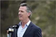  ?? AP PHOTO/NIC COURY ?? In this April 23 file photo, California Gov. Gavin Newsom speaks during a press conference in Big Sur, Calif. California on Saturday is increasing early release credits for tens of thousands of inmates including violent and repeat felons as it further trims the population of what once was the nation’s largest state correction­al system. Officials announced in mid-April that they will close a second prison as a result of the dwindling population, fulfilling a promise by Newsom.