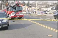  ?? Contribute­d photo ?? A fire department crew at the scene of a hit- and- run accident in Bridgeport on Friday.