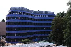  ?? The Associated Press ?? ■ Blue tiles clad the curved building of the new Jewish educationa­l and cultural complex Thursday in Berlin. The Pears Jewish Campus, run by the local Chabad community, is located in the German capital’s Wilmersdor­f neighborho­od and will be officially opened Sunday.