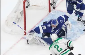  ?? The Canadian Press ?? Dallas Stars defenceman Jamie Oleksiak scores on Tampa Bay Lightning goaltender Andrei Vasilevski­y in Edmonton on Saturday.