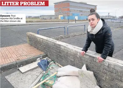  ??  ?? Eyesore Post reporter Abi Smillie at the litter- strewn site