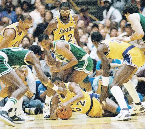  ?? — THE ASSOCIATED PRESS FILES ?? When Los Angeles Lakers star Magic Johnson was diving for loose balls against the Boston Celtics during the 1987 NBA Finals, North American was watching a fringe sport evolve into one of the most successful leagues in North America.