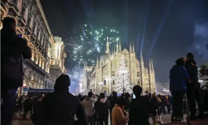  ?? Photograph: Matteo Corner/Ansa/Zuma Press/Rex/Shuttersto­ck ?? New Year celebratio­ns in front of Milan’s cathedral in Piazza del Duomo.
