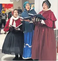  ??  ?? Victorian carol singers