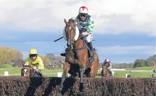  ?? Picture: PA. ?? Two Taffs ridden by Davy Russell on the way to victory in The Hillhouse Quarry Handicap Steeple Chase.