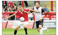  ?? PICTURES: Russ Sheppard ?? TOM’S TOPS: Tom Greaves is congratula­ted by Jake Williams Left: Captain Scott Kay and Hereford’s Ross Staley tussle for the ball