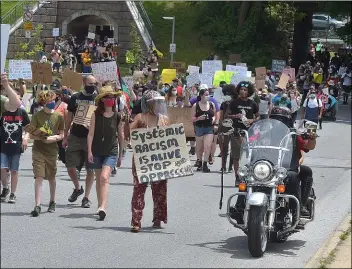  ?? PETE BANNAN - MEDIANEWS GROUP ?? Black Lives Protesters walk up Knowles Avenue in Glenolden. Members of the ‘Wheels of Soul’ motorcycle club escorted them.