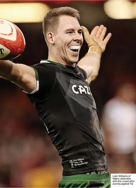  ?? ?? Liam Williams of Wales celebrates with the crowd after scoring against Fiji