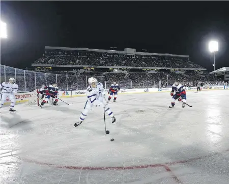  ?? THE ASSOCIATED PRESS ?? Toronto Maple Leafs centre Tyler Bozak skates with the puck during the first period of the outdoors NHL game against the Washington Capitals in Annapolis, Maryland, on Saturday night. The Capitals won 5-2.