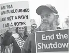  ?? GETTY IMAGES ?? TSA employee Marae Persson, left, and others protest the government shutdown in front of the James V. Hansen Federal Building in Ogden, Utah, last week.