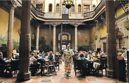  ??  ?? The atmosphere in Sanborn’s restaurant far exceeds the food at Casa de los Azulejos, an 18th-century palace in Mexico City.