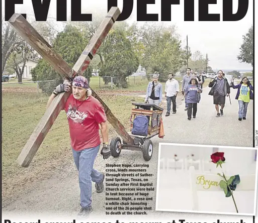  ??  ?? Stephen Hope, carrying cross, leads mourners through streets of Sutherland Springs, Texas, on Sunday after First Baptist Church services were held in tent because of huge turnout. Right, a rose and a white chair honoring one of the 26 people shot to...