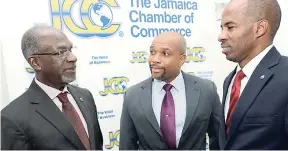  ??  ?? Managing director of Market Research Services Limited Don anderson (left) speaks with Vice-President at NCB Capital Market Herbert Hall (centre) and Chairman of the Jamaica Conference Board Lloyd Distant at the presentati­on of the 4th Quarter 2016...