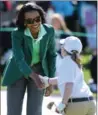  ?? CURTIS COMPTON, TNS ?? Former U.S. Secretary of State Condoleezz­a Rice congratula­tes Jayla Kucy during the Drive, Chip, and Putt National Finals.