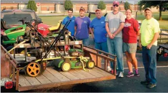  ?? Photograph courtesy of West Side Baptist Church ?? Members of West Side Baptist Church Billy Moore, Jennifer Massey, Clint Massey, Larry Whisenhant, John Garrett and JT Garrett spent a Saturday ministerin­g to a victim of the tornado in central Arkansas recently.