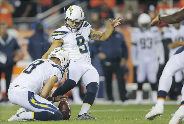  ?? — GETTY IMAGES FILES ?? Los Angeles Chargers kicker Younghoe Koo attempts a game-tying field goal in the fourth quarter against the Denver Broncos on Monday in Denver. Koo’s kick was deflected, but L.A. coach Anthony Lynn says he takes “full responsibi­lity” for allowing that...