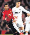  ??  ?? Up close: Chris Smalling takes on Rodrigo Moreno Machado