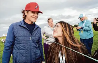  ?? LiPo Ching/Special to The Chronicle ?? Genevieve Aguilera asks for a selfie with actor Jason Bateman after he played the eighth hole at the Monterey Peninsula Country Club golf course at the AT&T Pebble Beach Pro-Am on Friday.