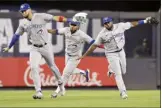  ?? AP photo ?? The Blue Jays’ Lourdes Gurriel Jr. (from left), Teoscar Hernandez and Jackie Bradley Jr. celebrate after Friday’s win.